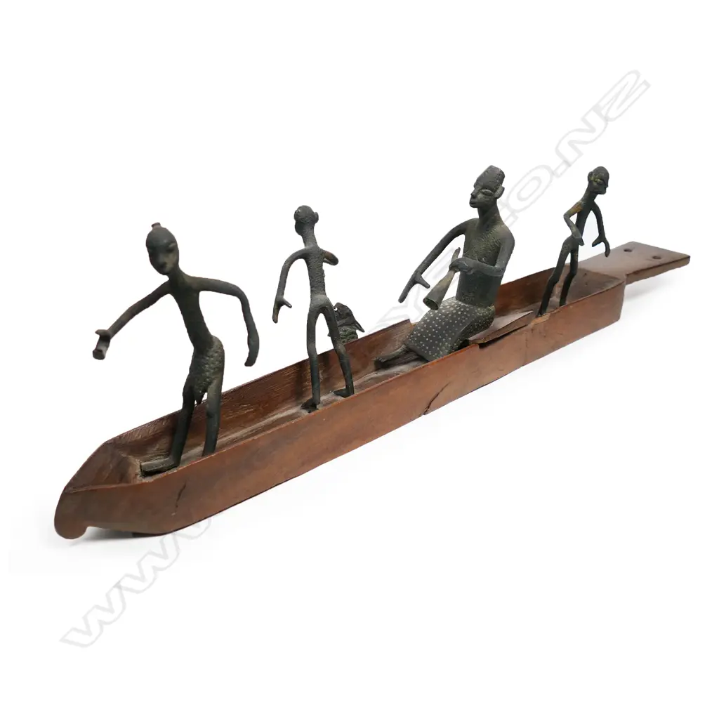 A vintage African(?) tribal carved wooden boat with four bronze figures – one with a fish, Image 1++